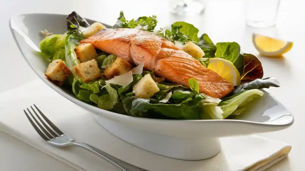Healthy Salmon Caesar Salad on White Plate
