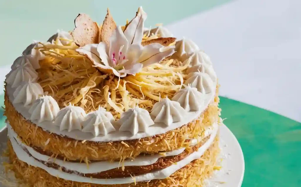 Layered Coconut Cake on Marble Stand