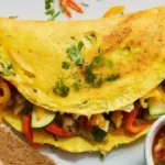 Colorful Veggie Omelet on White Plate